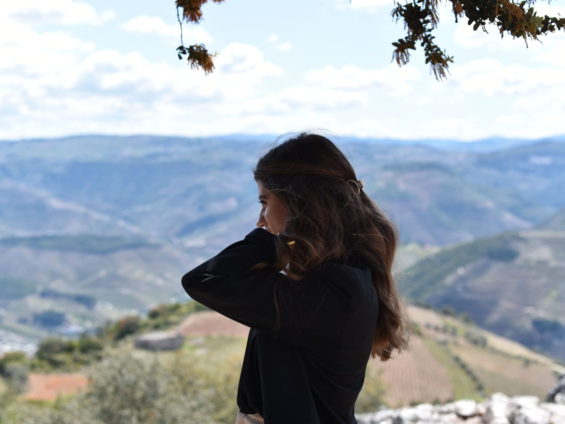 a lady standing on top of douor valey regionn