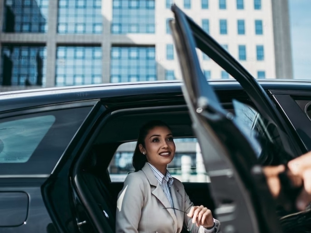 a person in a car talking on a cell phone