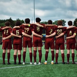 a group of football players posing for a picture