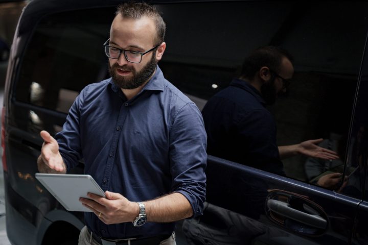 Transfer driver in front of the van