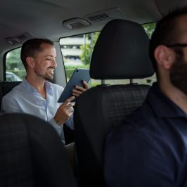 a man sitting in a chair getting a transfer to airport