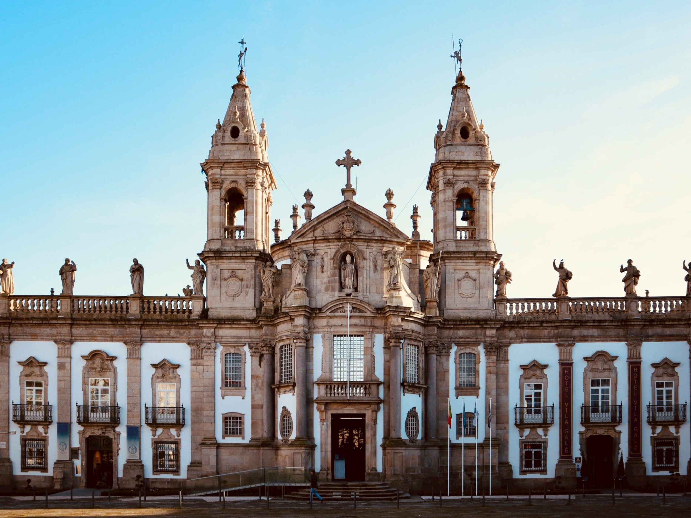 a clock tower in front of a building